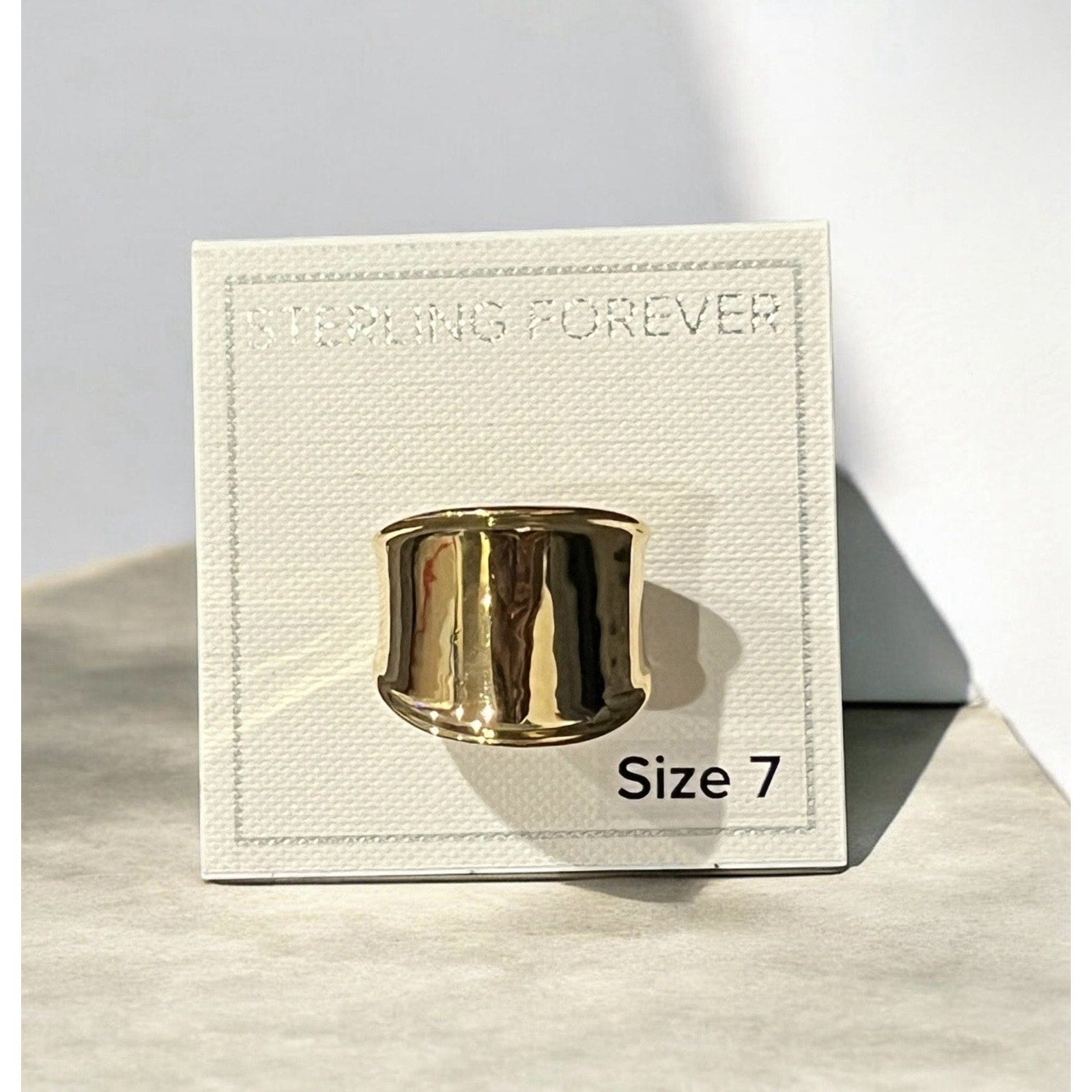 Sterling Forever ring features a bold, gold-plated wide band Size 7 New