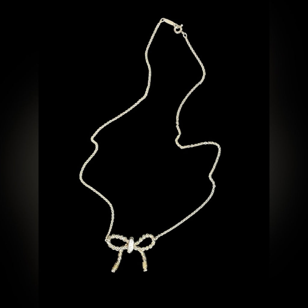 Tiffany & Co. 925 sterling silver and 750 Gold twist bow ribbon necklace.