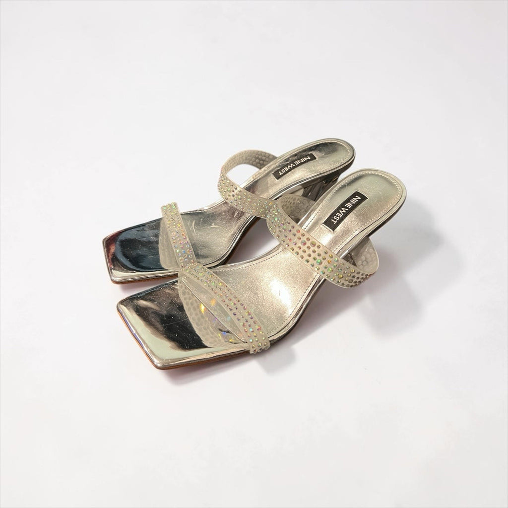Nine West Yogirl sandals feature a metallic silver shimmer Women’s 8