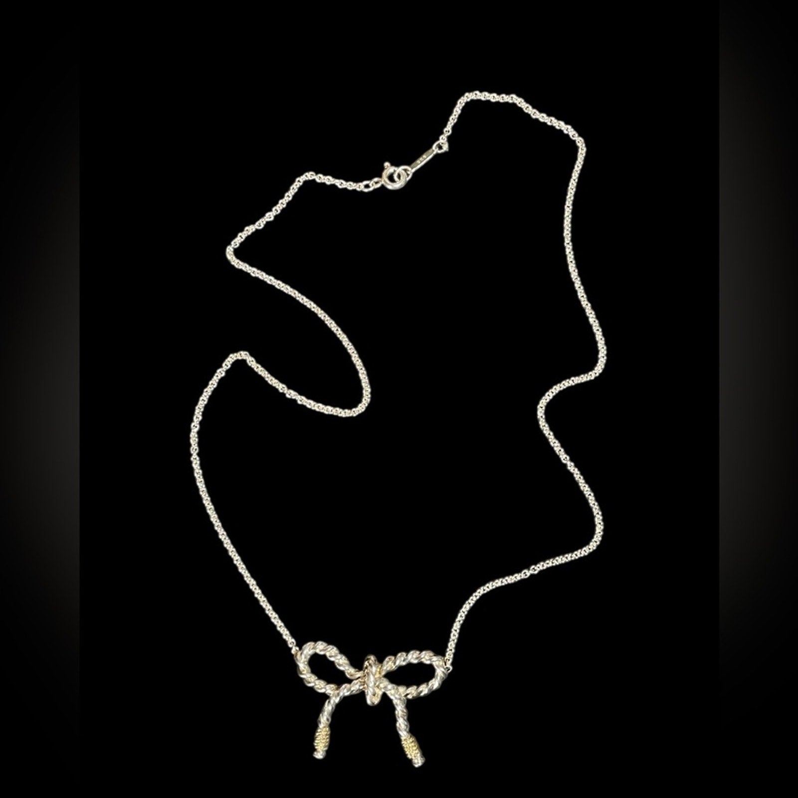 Tiffany & Co. 925 sterling silver and 750 Gold twist bow ribbon necklace.