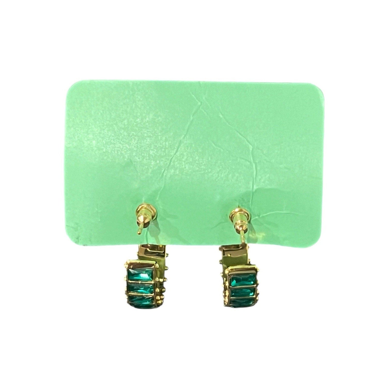 Short & Suite hoops feature emerald green baguette-cut crystals New
