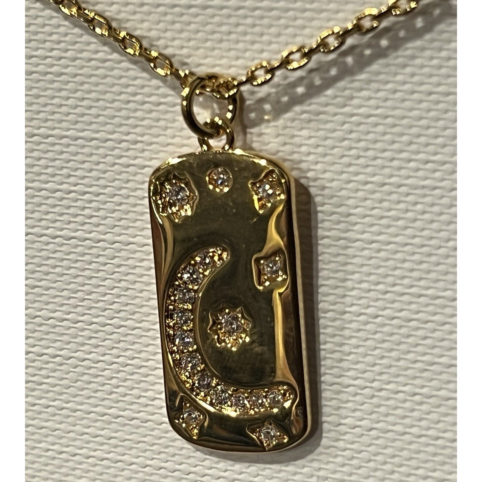 Sterling Forever gold-plated necklace features a celestial Moon And Stars Design