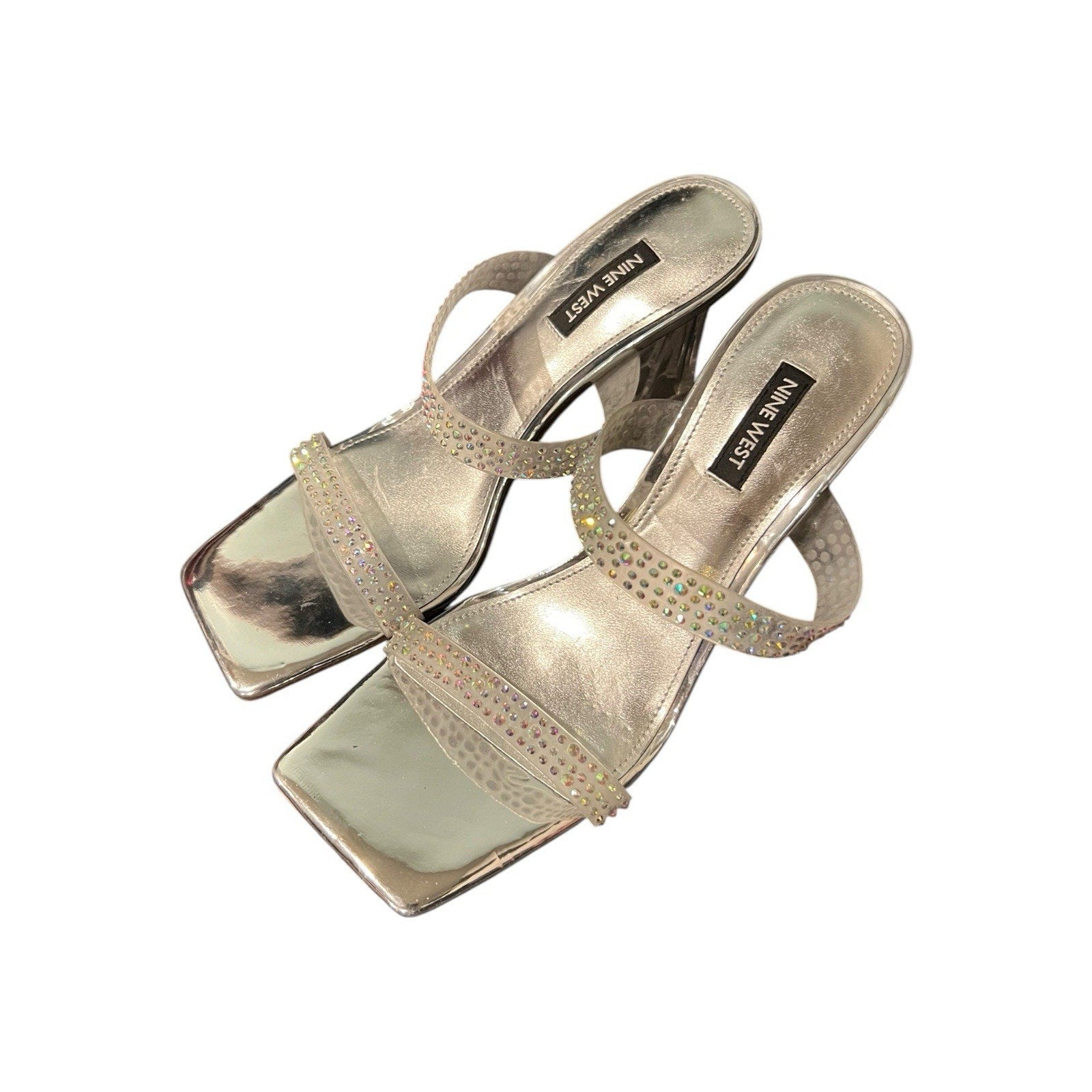 Nine West Yogirl sandals feature a metallic silver shimmer Women’s 8