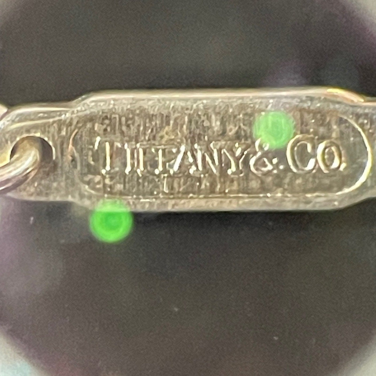 Tiffany & Co. 925 sterling silver and 750 Gold twist bow ribbon necklace.